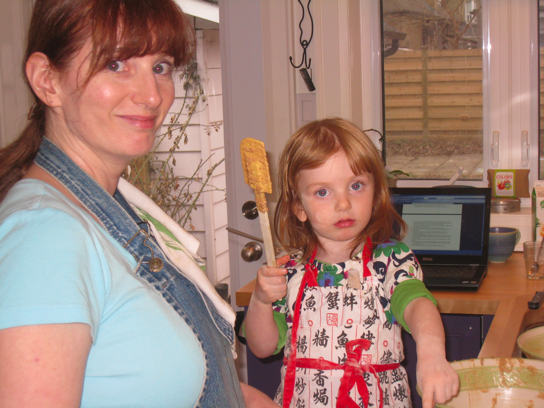 Sadie and Maddie baking cupcakes
