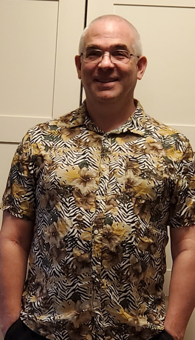 Greg in a loud shirt
